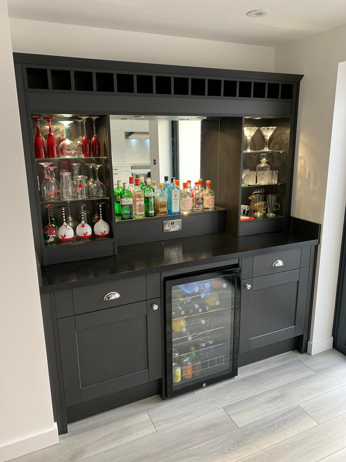 Black bar cabinet with glass shelving