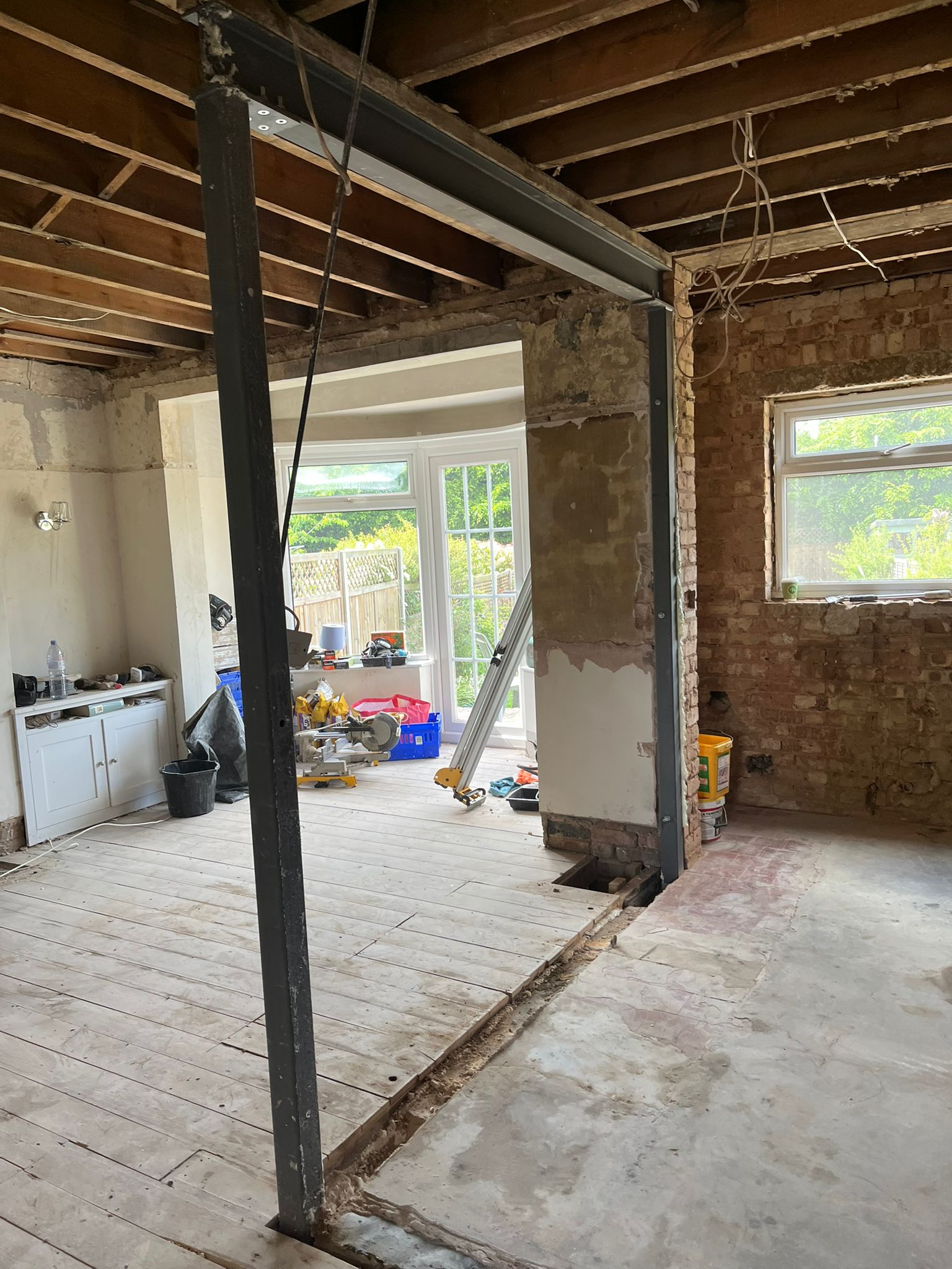 Before: heavily damaged interior wall