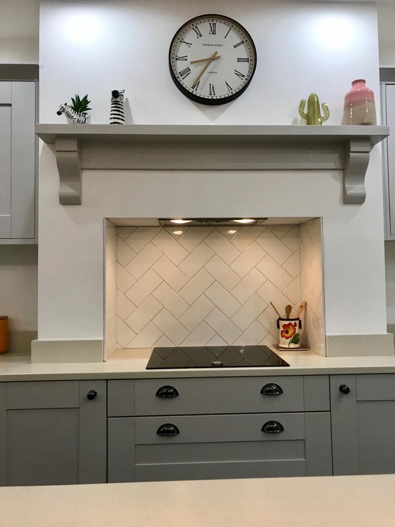Fireplace alcove with herringbone tile detail