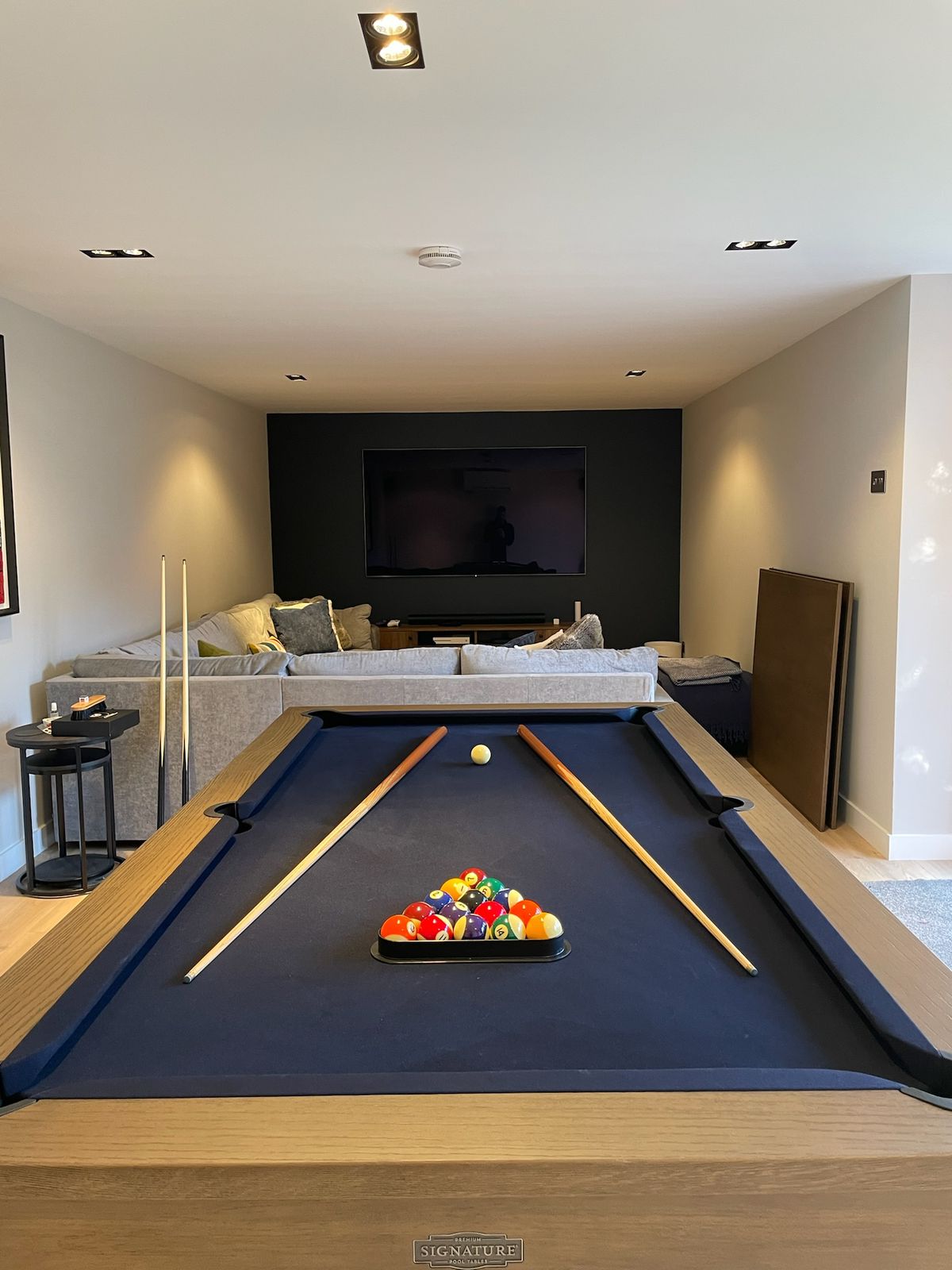 Games room with pool table and cinema setup