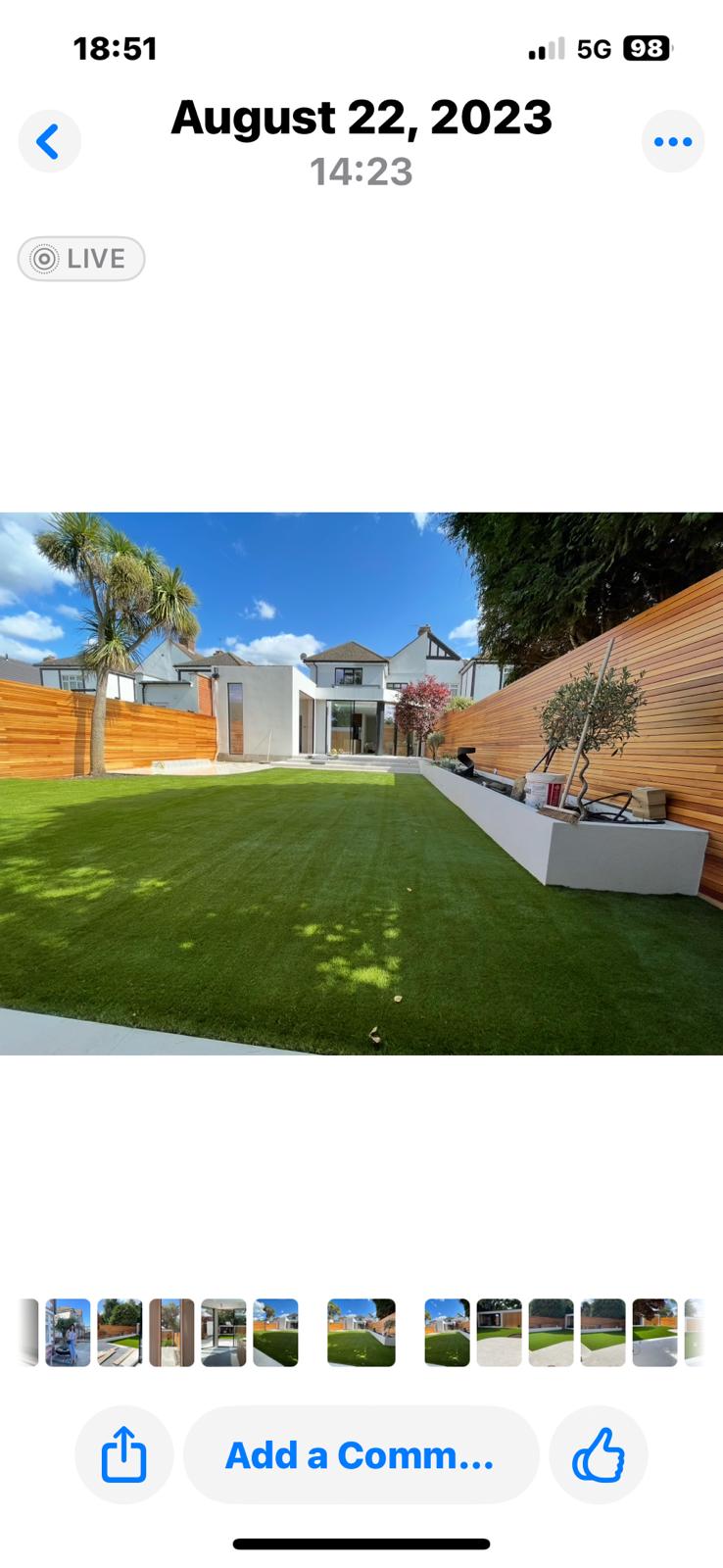 After: stunning landscaped garden with artificial turf, cedar fencing and palm trees